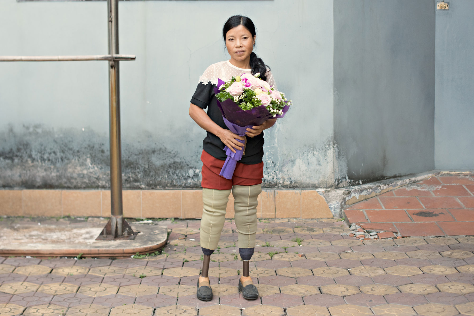 image of a woman holding flowers